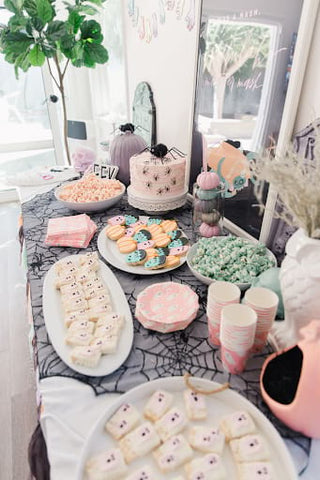 Ghost, cobweb, spider, and Frankenstein treats and table decor for a fall baby shower