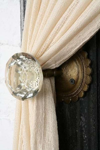 Nursery curtain tie-backs made from vintage doorknobs